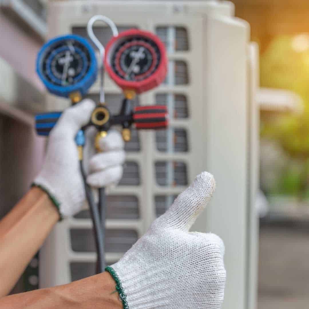 Photo of HVAC technician giving thumbs up